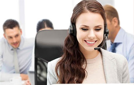 woman wearing a headset smiling