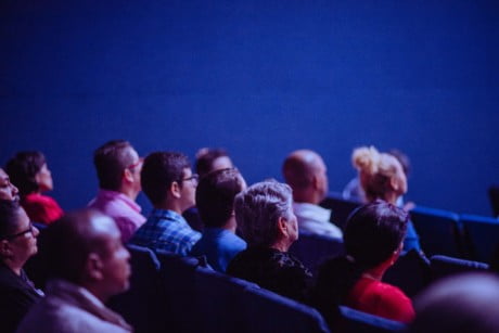 people sitting in audience of an event