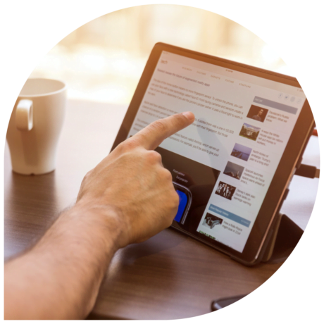 man-pointing-to-a-tablet-device-displaying-LinkedIn