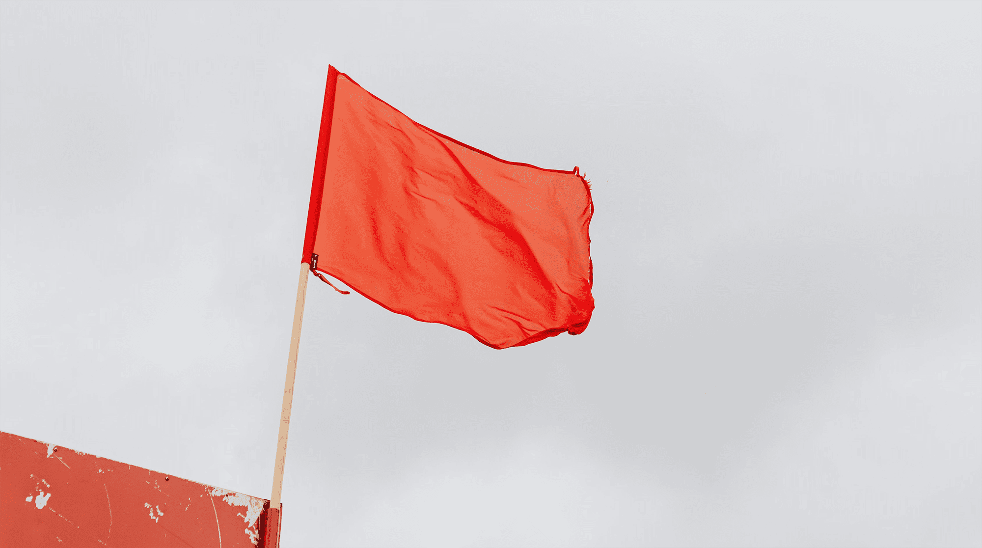 red-flag-waving-in-the-wind