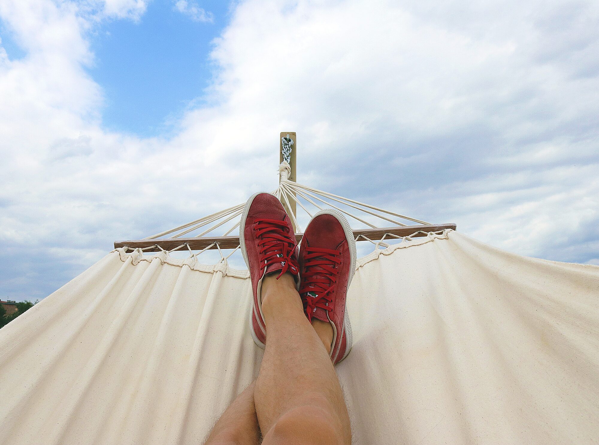 viewpoint-of-person's-shoes-on-a-hammock