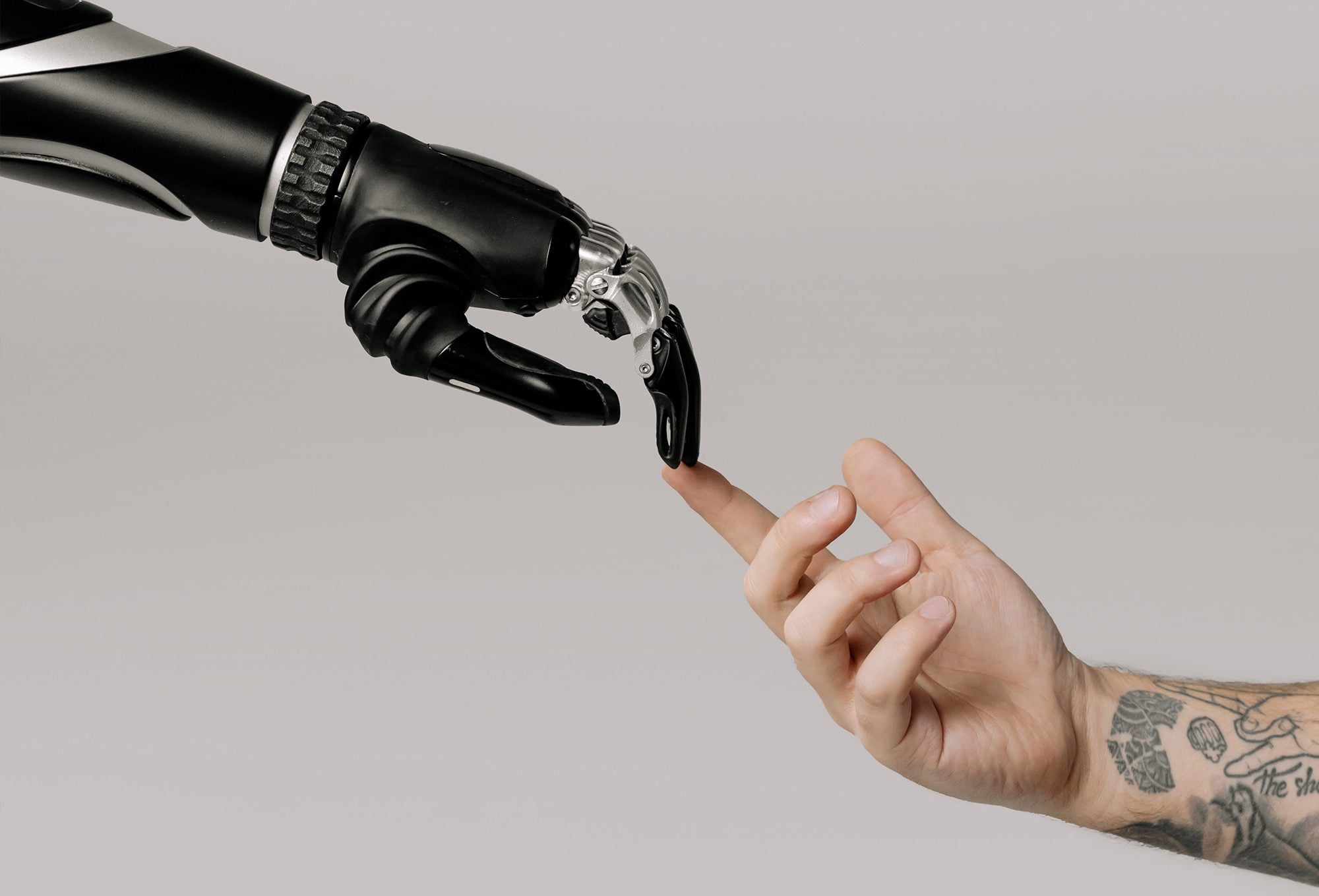 human-hand-touching-robot-hand