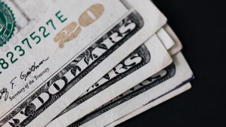 a pile of United States twenty dollar bills