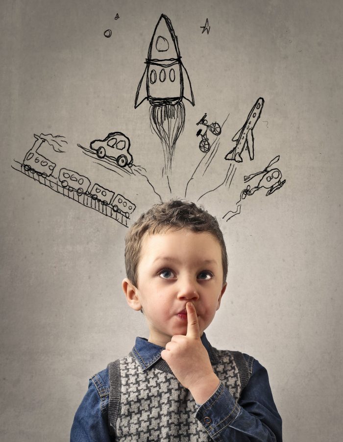boy with modes of transportation drawn above his head
