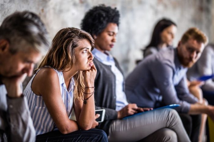 group of people listening in a meeting