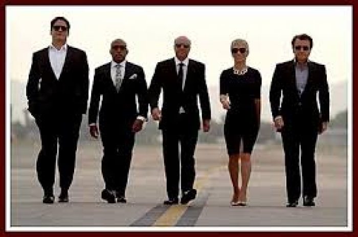 stars of shark tank walking in a row