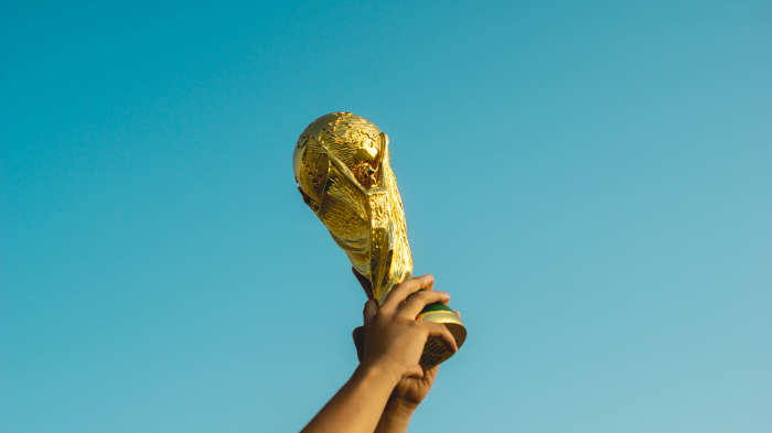 someone-holding-up-a-trophy